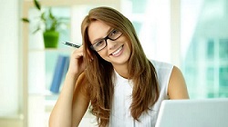 Happy lady with long dark brown hair with head tilted to the side, happy about learning how to become and affiliate marketer for free