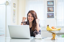 Happy woman excited about her results with the best way to make money online with affiliate marketing