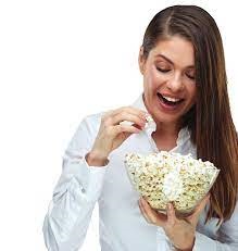 Lady with long brown hair holding a bowl of protein popcorn, the ultimate snack solution for a healthy family snack alternative to junk food.