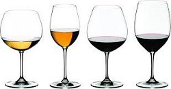 Four wine glasses with wine inside depicting the wine variations of exclusive fine wines.