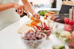 Food in bowls on a table representing kitchen food prep and time saving kitchen gadgets for busy families.