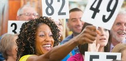 A crowd of auction bidders. Step-by-step guide to hosting a charity auction online