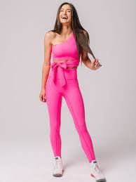 Brunette dancer showing off her hot pink women's dance performance leggings
