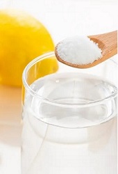 baking soda in a cup of water with lemon provide good benefits of an alkaline body with baking soda