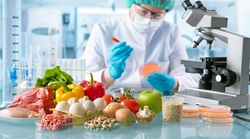 Food science expert in a white coat and mask over her face, with meats, vegetables, and grains scattered across the counter, analyzing how seed oils and sugar effect your health.